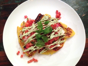 Pan fried plantains topped with Mahi & avocado crema